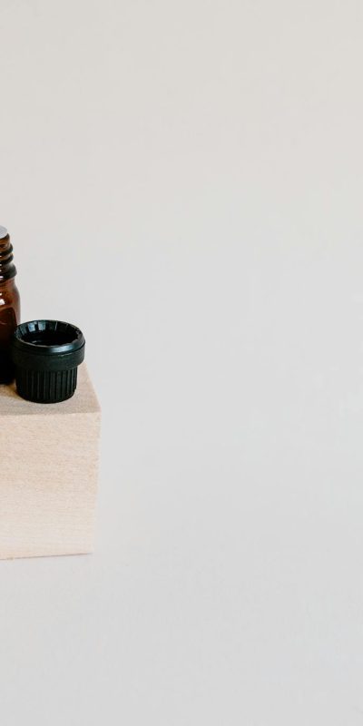 Brown Bottle on Wooden Block