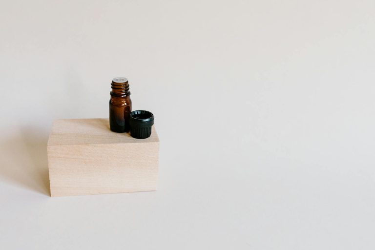 Brown Bottle on Wooden Block