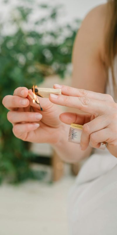 Woman in White Dress Holding Cigarette Stick